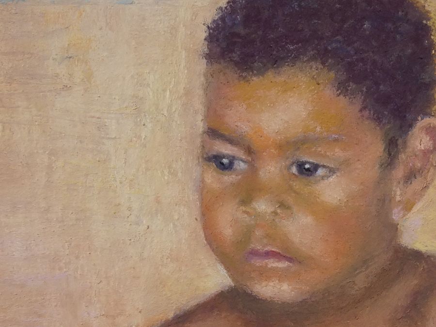 Indigenous boy painting- close up of face